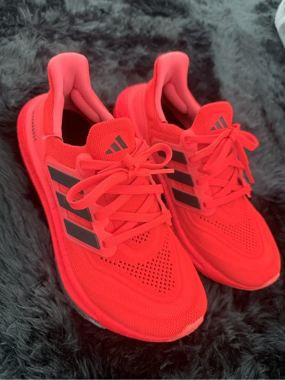 adidas red orange Ultraboost Running Sneakers.